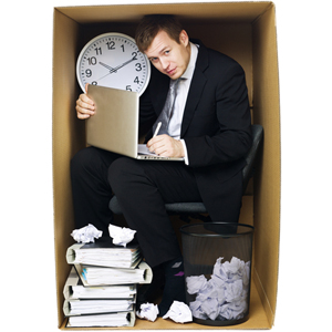 man inside small box with office items